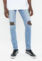 Cheap Monday - Tight fit knee rip jeans - blue