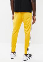 nike nsw yellow pants