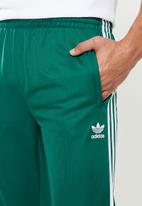 sst track pants green