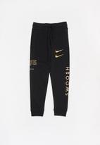 black and gold nike pants