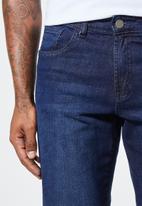 Superbalist - Cade slim cuffed jeans - dark washed blue