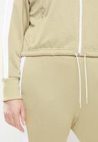 PUMA - Plus iconic t7 crop jacket - beige