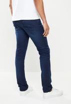 GUESS - Ringer slim fit tapered jeans - blue