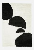 Hertex Fabrics - Balance boulder rug - white & black