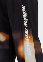 adidas Originals - GRAPHICS Y2K Yung TRACK PANTS - black & orange rush