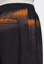 adidas Originals - GRAPHICS Y2K Yung TRACK PANTS - black & orange rush