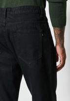 Superbalist - Axel loose tapered jeans - black