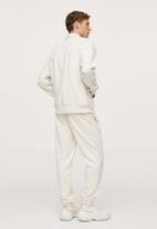 MANGO - Brava Cotton jogger-style trousers - light beige