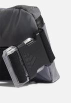adidas Performance - Sports waistbag - reflective/black
