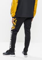 Kaizer Chiefs - Urban Edition - KC pattern collage trackpants - black & yellow