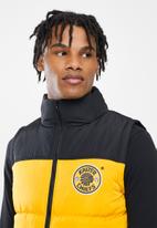 Kaizer Chiefs - Urban Edition - KCFC Puffer  Vest t - Yellow/Black