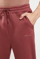 Jonathan D - Men's branded sweat pants - red
