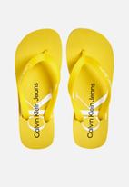 CALVIN KLEIN - Beach sandal monogram tpu - super lemon