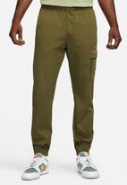 Nike - NSW Woven Trousers.- rough green & safety orange
