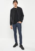 Cutty - Root skinny fit knitted coated denim jean - tint