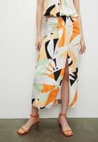 VELVET - Co-ord printed front draped sarong skirt - abstract geo tangerine