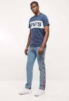 levi's taper sports stripe