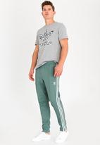 adidas beckenbauer pants green