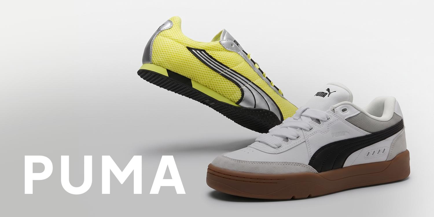 Puma Black Friday promotional banner with two white and black Puma sneakers flanking bold black text reading “BLACK FRIDAY” on a light background.