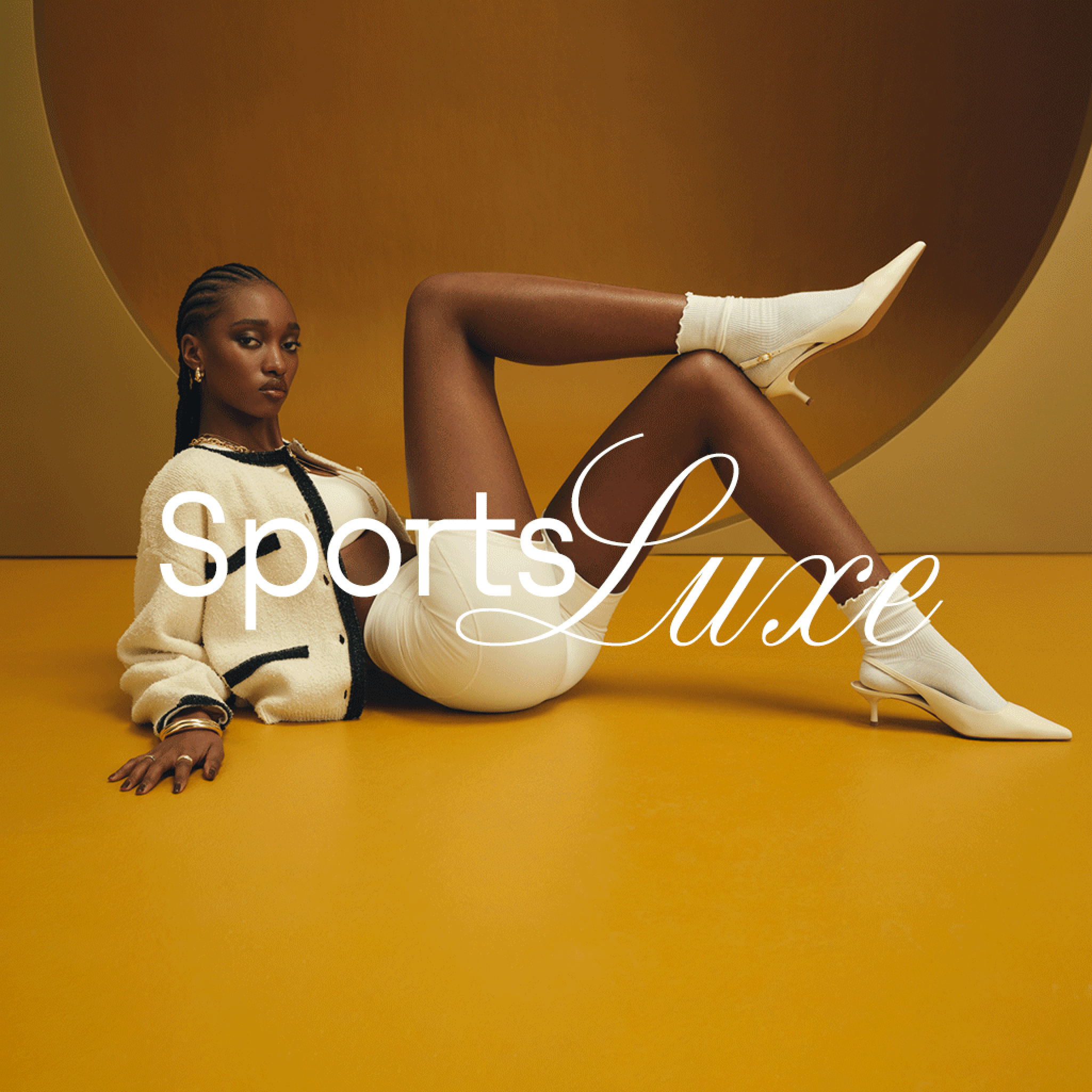 Close-up of cream sneakers with brown stripes paired with white ruffled socks and a lace skirt. Sneakers collection.