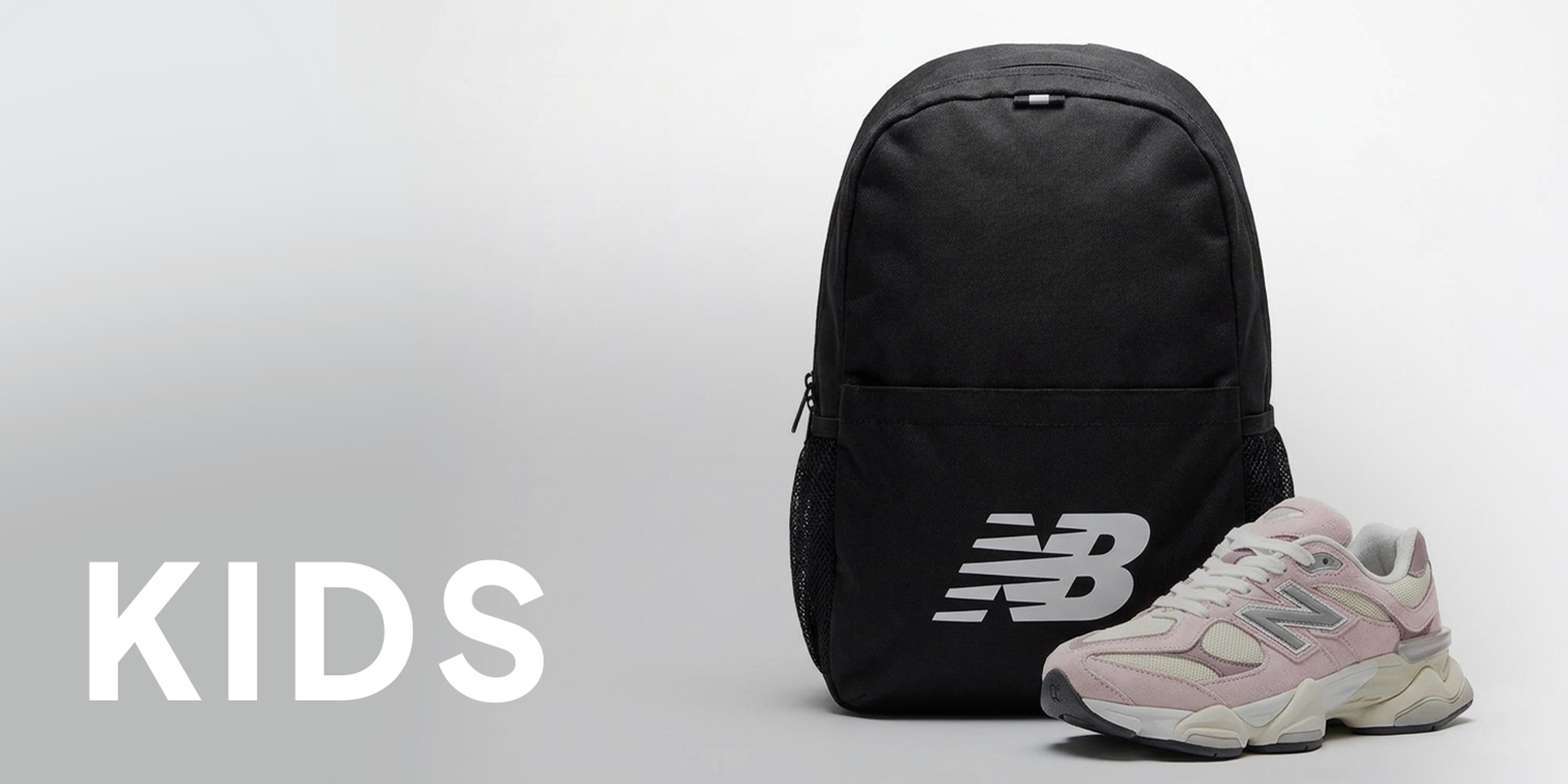 Black New Balance backpack and pink-and-white New Balance sneaker on a light gray background, with large white “KIDS” text on the left.