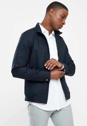 white and black polo jacket