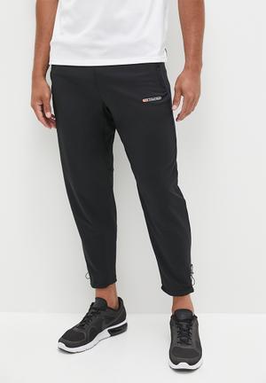 NIKE Zip-detailed cotton-blend jersey track pants