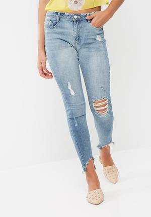 Anarchy mid rise step hem skinny jeans