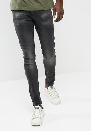 Washed twisted seam skinny jeans