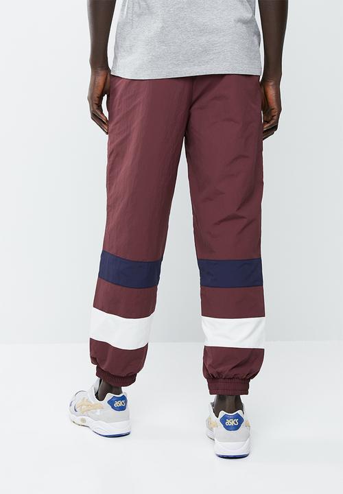 Asics Tiger - CB windbreaker pants - burgundy