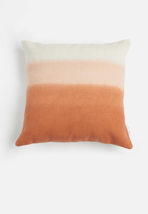 orange cushions and throws