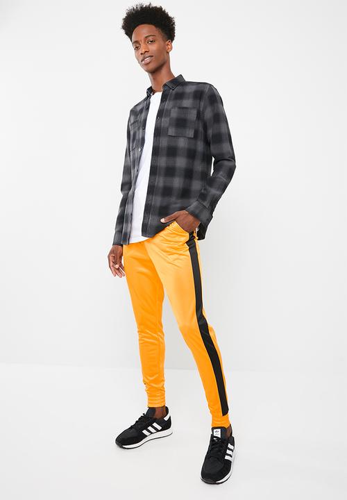 Superbalist - Slim side stripe tricot pant - orange and black