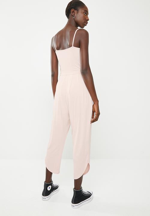 Superbalist - Strappy yoga jumpsuit with pockets at the hip - pink