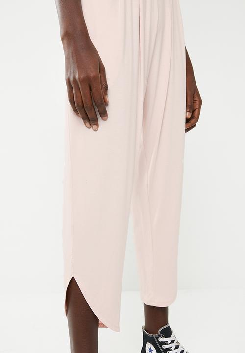 Superbalist - Strappy yoga jumpsuit with pockets at the hip - pink