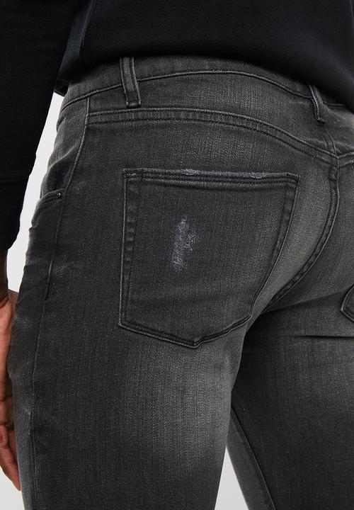 Superbalist - Skinny jeans with released hem - black