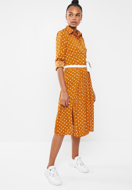 yellow and white polka dot shirt