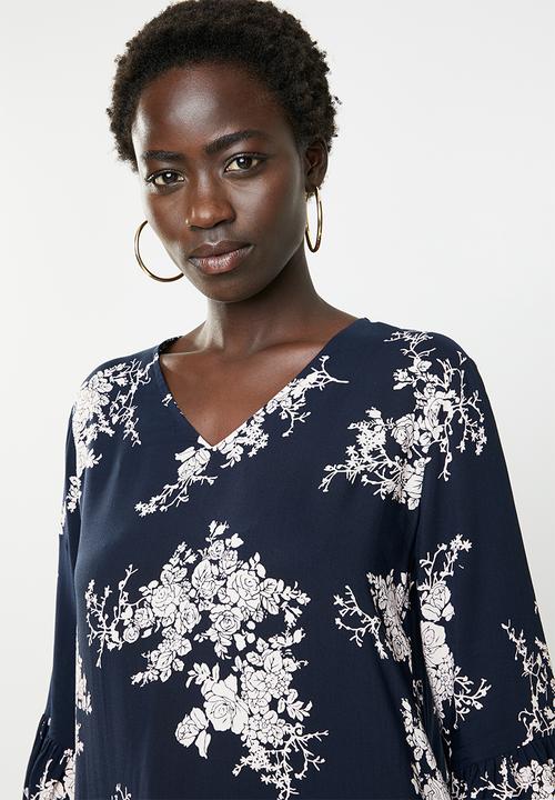 Revenge - Floral dip hem fluted sleeve top - navy
