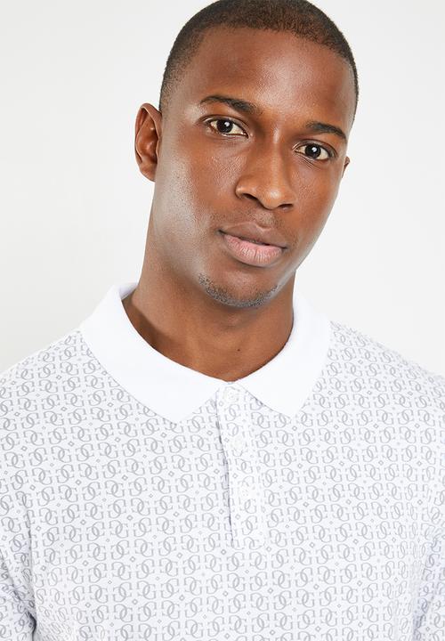 GUESS - Short sleeve quatro all over print golfer - white