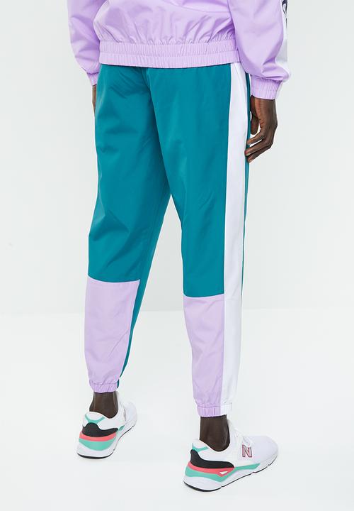 New Balance  - NB athletics windbreaker pant - green & white