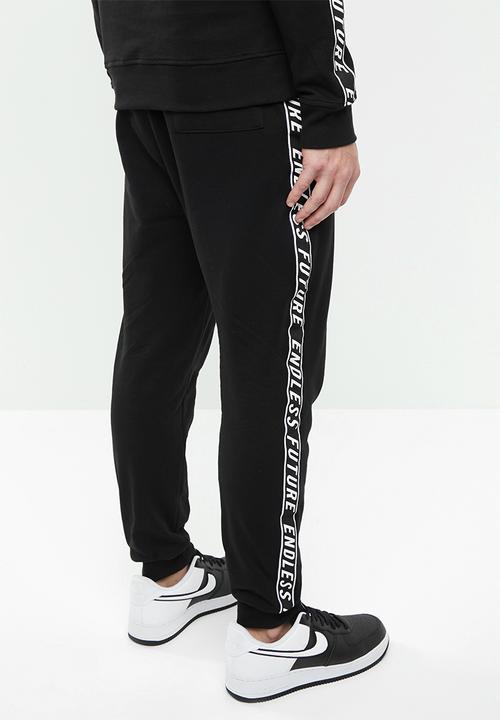 Superbalist - Slim fit printed tape sweat pant - black