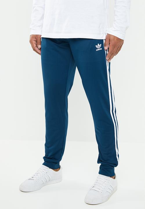 white adidas pants with blue stripes