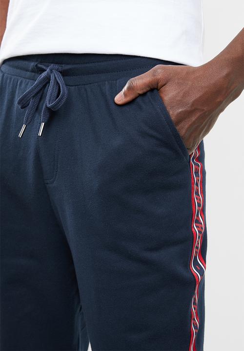 Superbalist - Slim fit printed tape sweatpant - navy & red 