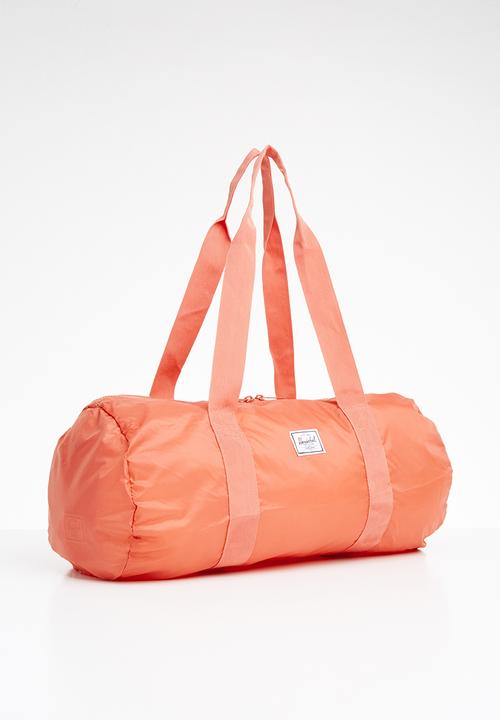 HERSCHEL - Packable duffle bag - peach