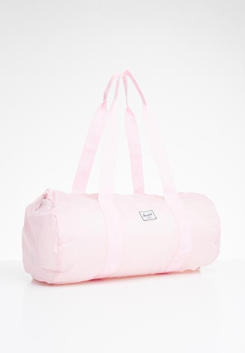 HERSCHEL - Packable duffle bag - pink