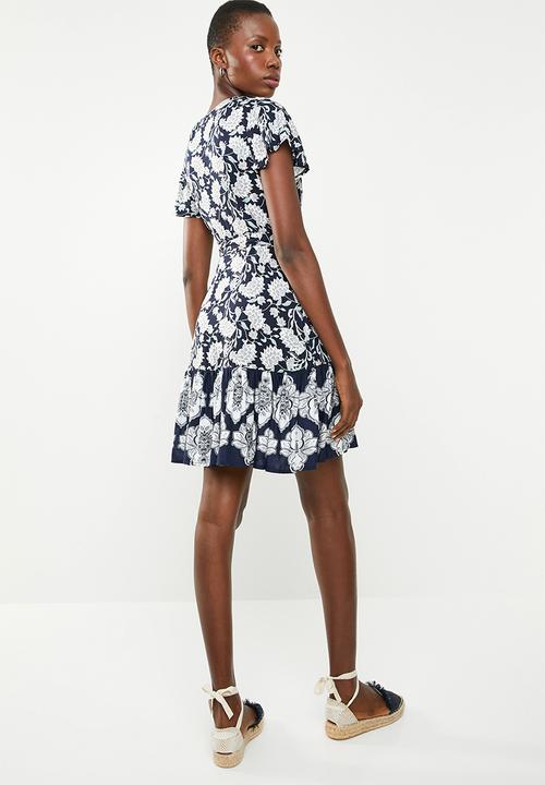 Revenge - Wrap over floral dress with contrast border - navy