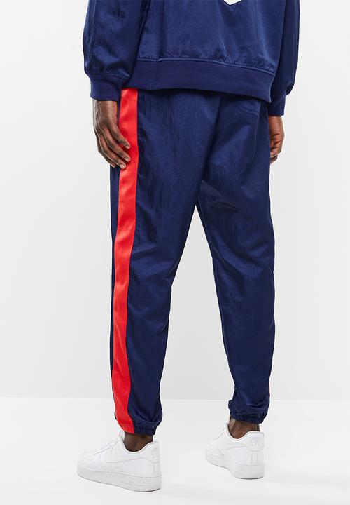 Nike - Nsw nsp pant wvn - blue & red