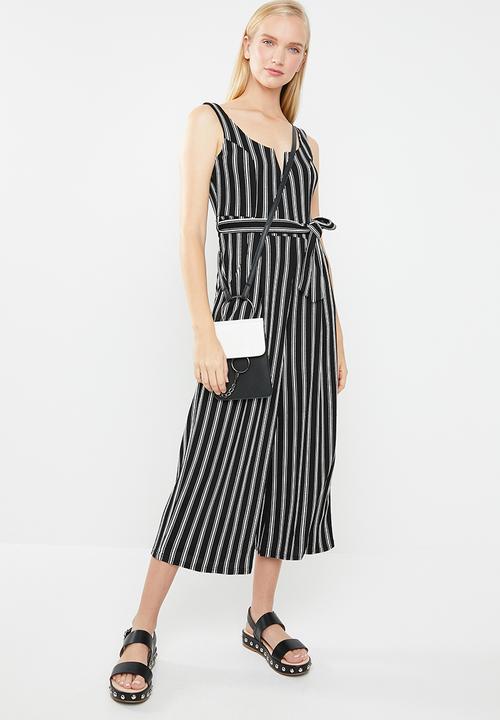 Revenge - V-front cut-out striped print jumpsuit - black & white 