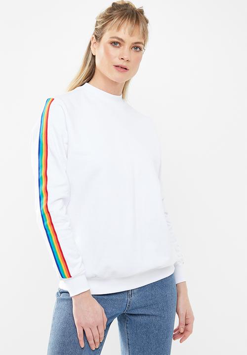 white sweatshirt with rainbow stripe