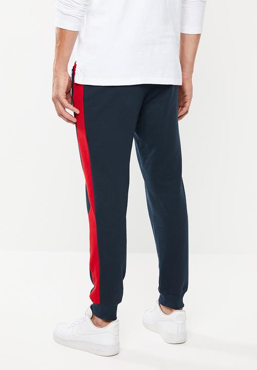 Superbalist - Skinny side stripe sweatpants - navy & red 
