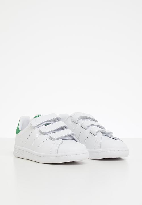 white and green adidas shoes